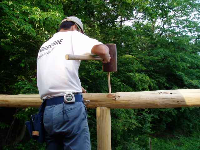 knock two pegs into the joint of log girder