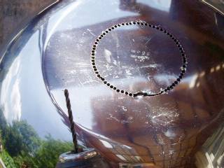 drilling a hole in the bottom of a stainless bowl
