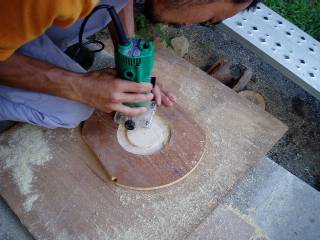 cutting a board with trimmer