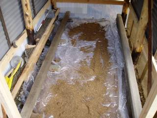 cover the ground with a piece of used vinyl sheet for dampproofing