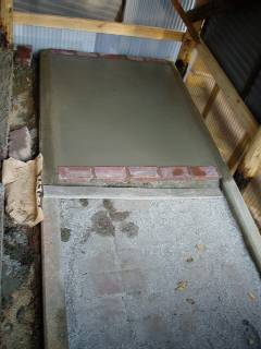 lay interlocking concrete pavers (used) and then place concrete on it