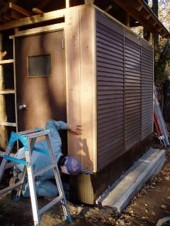entrance door and cedar board wall