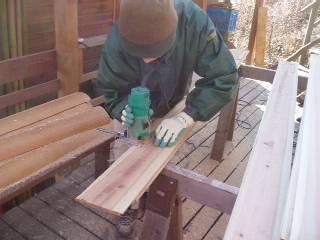 cut off the edge of cedar boards so that they fit each other