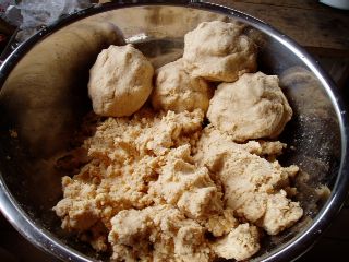 mix the mashed soybeans with koji (malted rice) and salt and make balls