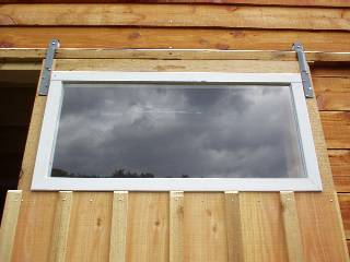 sliding door hung from the rail above