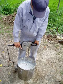 mixing plaster with a machine