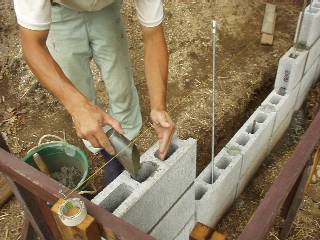pour mortar into holes