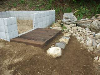 used railroad ties for the entrance of the hut