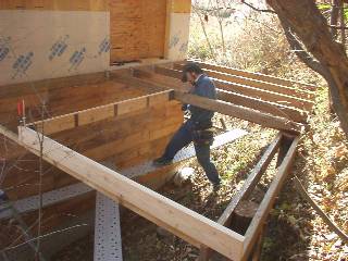 place the deck joists on the beam