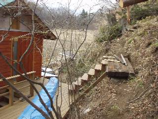 the stairs from the deck to the trail above