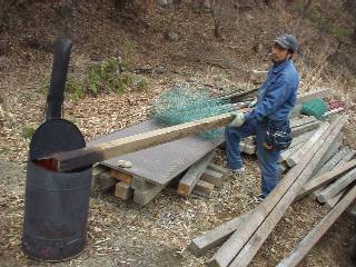 scorching old lumbers to use as poles