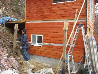 attach a little roof to the west side wall as well