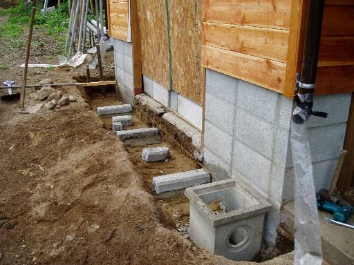 make a drain in front of the southside sliding doors